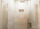 Modern shower with a built-in niche and sleek, gray tile at 8012 Red Lantern Rd, Indian Trail, NC 28079