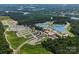 Aerial view of the US National Whitewater Center surrounded by lush forest and the Catawba River at 8036 Joy Crossing Ln, Charlotte, NC 28214