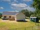 Backyard featuring a deck, shed, and lush lawn at 814 Carved Oak Ct, York, SC 29745