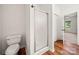 Bathroom featuring a glass shower and wood floors at 814 Carved Oak Ct, York, SC 29745