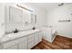Bright bathroom featuring a tub and double vanity sinks with modern fixtures and wood floors at 814 Carved Oak Ct, York, SC 29745