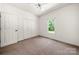 Bedroom with ceiling fan, large window, and a closet at 814 Carved Oak Ct, York, SC 29745