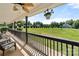 Expansive front porch offering scenic views, featuring comfortable seating, stylish railings and decorative hanging plants at 814 Carved Oak Ct, York, SC 29745