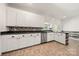 Kitchen with white cabinets, modern appliances, and a backsplash, offering a cozy atmosphere at 814 Carved Oak Ct, York, SC 29745