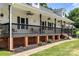 Inviting covered porch with comfortable seating, ceiling fans, and decorative touches, perfect for enjoying the outdoors at 814 Carved Oak Ct, York, SC 29745