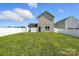 A spacious backyard featuring a well-maintained lawn, a white privacy fence, and mature trees at 8152 Chilkoot Ln, Locust, NC 28097