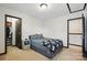 This cozy bedroom features a comfortable bed, a small closet, and a neutral palette at 8152 Chilkoot Ln, Locust, NC 28097