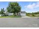 Charming home with attached garage, mature landscaping, and inviting curb appeal at 8152 Chilkoot Ln, Locust, NC 28097
