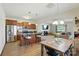 Inviting open concept with kitchen island, stainless appliances, and seamless flow to dining and living areas at 8152 Chilkoot Ln, Locust, NC 28097