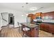 Modern kitchen featuring a functional island with seating, stainless steel appliances, and ample cabinet space at 8152 Chilkoot Ln, Locust, NC 28097