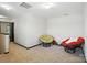 Bright loft space with neutral carpet, reading chairs, and natural light at 8152 Chilkoot Ln, Locust, NC 28097