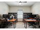 Dedicated home office space with desks and shelving, perfect for remote work or study at 8152 Chilkoot Ln, Locust, NC 28097