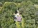 High angle view of a home site featuring lush trees and a circular drive at 820 King Rd, Clover, SC 29710