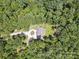 Aerial shot of a private home surrounded by trees, with a circular driveway and fenced yard at 820 King Rd, Clover, SC 29710