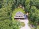 Overhead view of a serene home nestled in a lush, green landscape with a fenced backyard at 820 King Rd, Clover, SC 29710