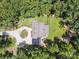 Bird's eye view of a secluded residence featuring a fenced yard and circular driveway among mature trees at 820 King Rd, Clover, SC 29710