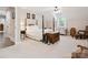 Spacious bedroom with a four-poster bed, ample natural light, and comfortable seating at 820 King Rd, Clover, SC 29710
