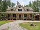 Inviting home showcasing a long covered porch and an oversized driveway at 820 King Rd, Clover, SC 29710