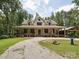 Inviting home showcasing a long covered porch and an oversized driveway at 820 King Rd, Clover, SC 29710