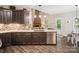 Well-designed kitchen with dark wood cabinets and an island bar area at 820 King Rd, Clover, SC 29710