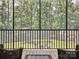 A screened-in porch with seating offers a view of the lush backyard and shed at 820 King Rd, Clover, SC 29710