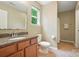 Well-lit bathroom featuring a granite vanity, tile flooring, and a shower-tub combination at 8214 Aspen Ct, Mint Hill, NC 28227