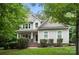 Charming home with a well-maintained lawn, beautiful landscaping, and a welcoming entrance at 8214 Aspen Ct, Mint Hill, NC 28227