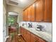 Spacious kitchen with long countertops, lots of cabinet space, hardwood floors, and stainless steel appliances at 8214 Aspen Ct, Mint Hill, NC 28227