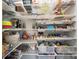 Walk-in pantry features wire shelving, providing ample storage space for food and household items at 8214 Aspen Ct, Mint Hill, NC 28227