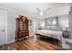 Bedroom featuring gray walls, wood-look floors, a ceiling fan, and dresser at 835 Holshouser Rd, Rockwell, NC 28138