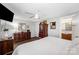 Bedroom with two dressers, a ceiling fan, wood-look floors, and access to an ensuite bathroom at 835 Holshouser Rd, Rockwell, NC 28138