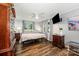 Bedroom with gray walls, wood-look floors, ceiling fan and window view at 835 Holshouser Rd, Rockwell, NC 28138