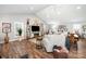 Bright living room with vaulted ceilings, recessed lighting, white couches, wood flooring and ceiling fan at 835 Holshouser Rd, Rockwell, NC 28138