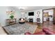 Inviting living room features a fireplace, hardwood floors, and neutral decor, perfect for relaxation at 835 Holshouser Rd, Rockwell, NC 28138