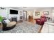 Spacious living room with fireplace, hardwood floors, and comfortable seating at 835 Holshouser Rd, Rockwell, NC 28138