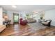 Cozy living room with hardwood floors, comfortable seating, and natural light at 835 Holshouser Rd, Rockwell, NC 28138