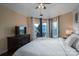 Well-lit bedroom with a view to the patio, neutral colors, and comfortable furniture at 1018 Southwest Sw Dr # 18, Davidson, NC 28036
