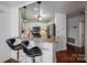 Modern kitchen with granite countertops, stainless steel appliances, and a breakfast bar at 1018 Southwest Sw Dr # 18, Davidson, NC 28036