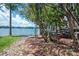 Scenic lakefront property with a tranquil view, lush greenery, and a pathway along the shore at 1018 Southwest Sw Dr # 18, Davidson, NC 28036