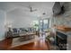 Spacious living room with a stone fireplace, sliding door to outside patio, and comfortable seating area at 1018 Southwest Sw Dr # 18, Davidson, NC 28036