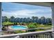 View from the balcony to the pool and pond fountain in the condo community at 1018 Southwest Sw Dr # 18, Davidson, NC 28036