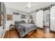 Bedroom features hardwood floors, sliding closet door, and modern ceiling fan at 1019 Richard St, Salisbury, NC 28144