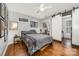 Bedroom features hardwood floors, sliding closet door, and modern ceiling fan at 1019 Richard St, Salisbury, NC 28144