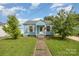 Inviting home with blue siding, white trim, and a neatly landscaped front yard at 1019 Richard St, Salisbury, NC 28144