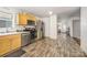 Open kitchen featuring stainless steel appliances, light wood cabinets, and hardwood floors at 1019 Richard St, Salisbury, NC 28144