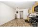 Functional kitchen and dining area boasting hardwood floors and neutral color palette at 1019 Richard St, Salisbury, NC 28144