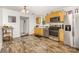 Modern kitchen with stainless steel appliances, light wood cabinets, and hardwood flooring at 1019 Richard St, Salisbury, NC 28144
