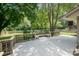 Spacious backyard deck surrounded by lush greenery, offering a serene outdoor living space at 10206 Washam Potts Rd, Cornelius, NC 28031