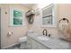 Charming bathroom with granite counters, floral accents, a stylish mirror, and a bright window at 10206 Washam Potts Rd, Cornelius, NC 28031