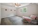 Bright bedroom featuring carpet floors, ceiling fan, and a comfy daybed at 10206 Washam Potts Rd, Cornelius, NC 28031